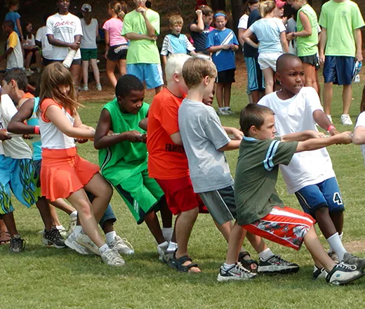 Camp kids playing tug of war
