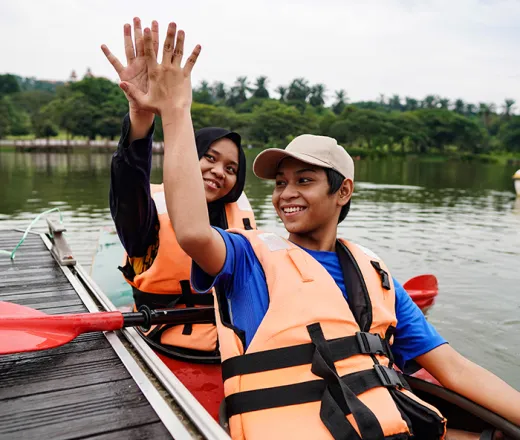 2 teenagers in a kayak
