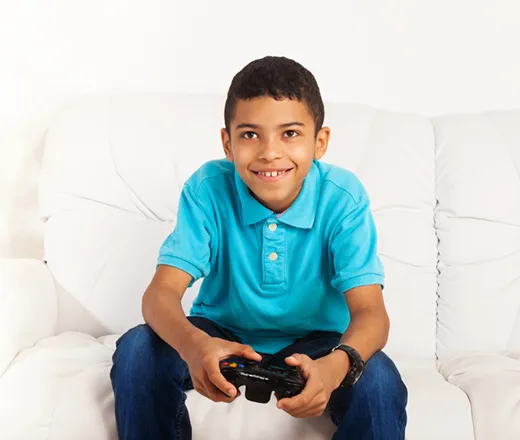 Middle schooler playing video game