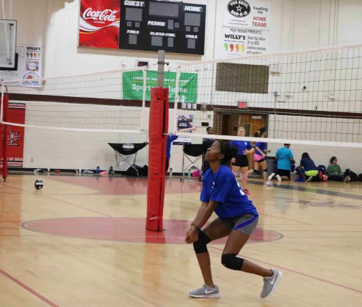teen girl playing volleyball