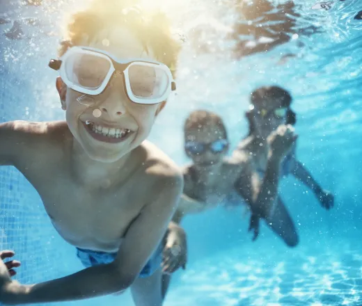 children swimming underwater