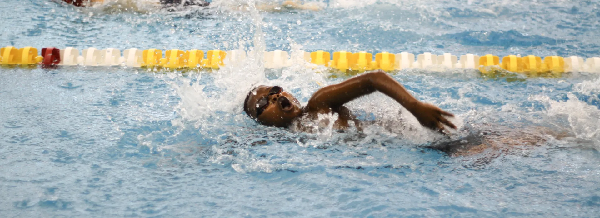 Swim Team member swimming in lane